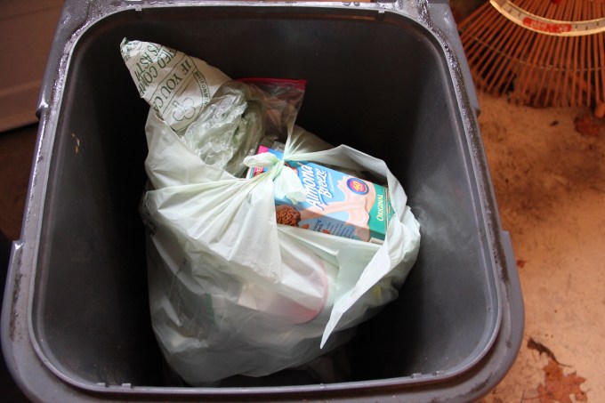 Here is 4 weeks of trash that filled 2 green trash bags